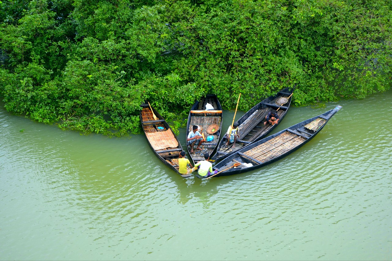 Traditional wooden boats on a river in rural Bangladesh