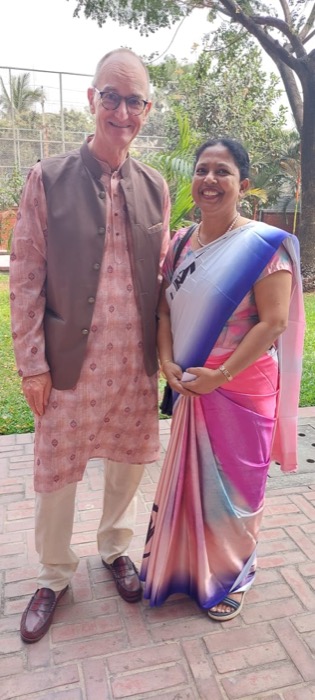 A BLCC teacher and student dressed in traditional Bangladeshi attire at a cultural gathering