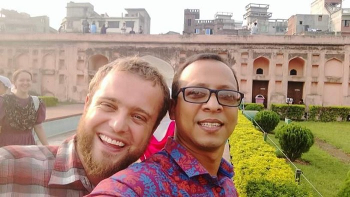A BLCC student and teacher exploring a historic building in Dhaka