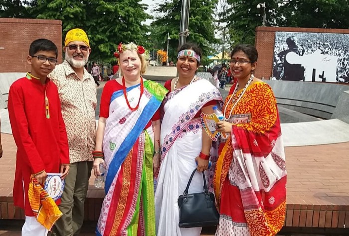 BLCC students and teacher dressed in traditional Bangladeshi attire at a public monument