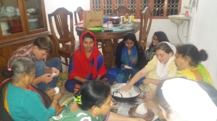 BLCC students helping prepare traditional Bangladeshi food with local families
